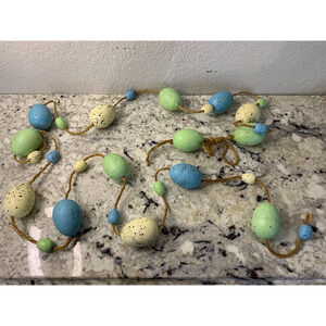 Easter egg garland several strands‎ included with cream, blue, and green eggs